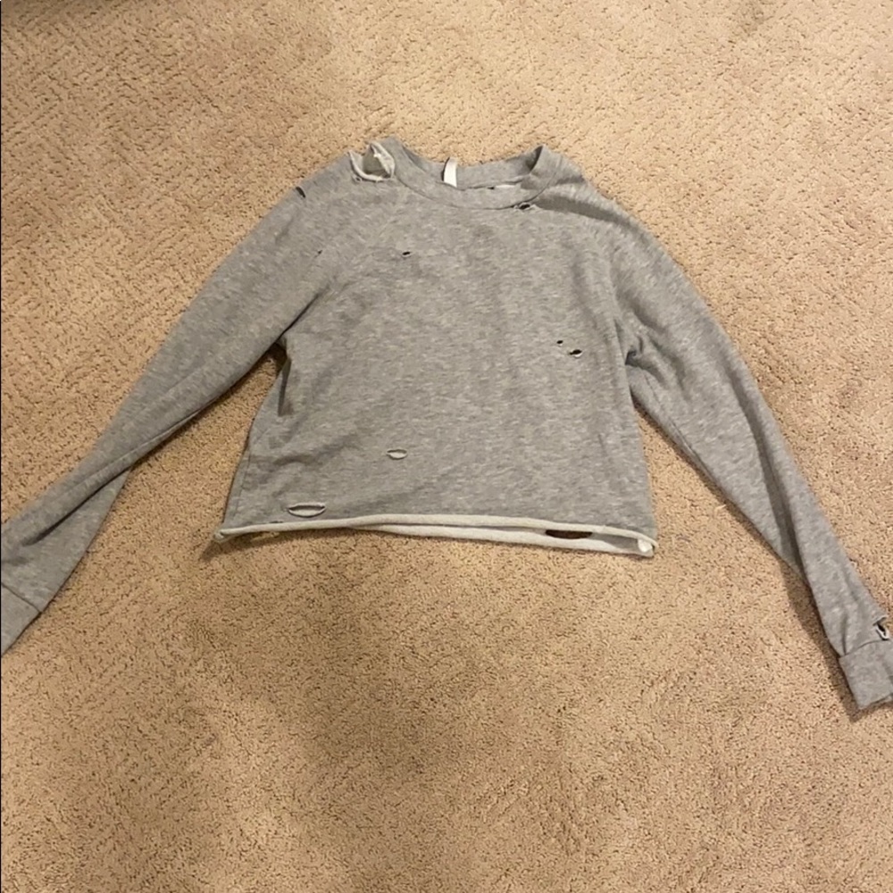 I am selling a gray crewneck sweatshirt.